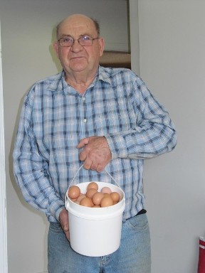 Bill with fresh picked eggs.